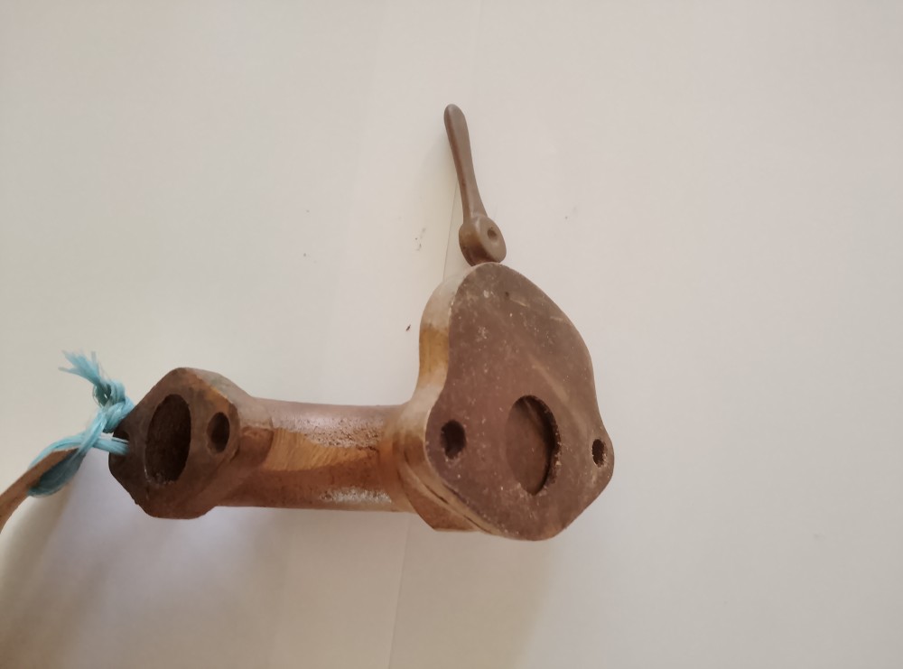 Image of a model D inlet elbow and throttle arm