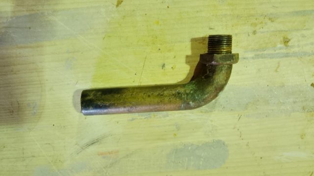 image of a second hand bronze elbow and locking nut for exhaust box
